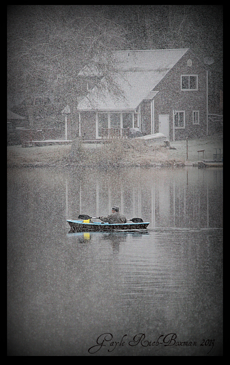 Kayaker on Fishhawk Lake During a New Snowfall New Year's Eve